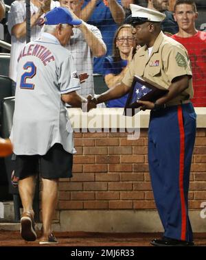 Former New York Mets manager Bobby Valentine waves as he is introduced  during an Old-Timers' Day ceremony before a baseball game between the  Colorado Rockies and the New York Mets on Saturday