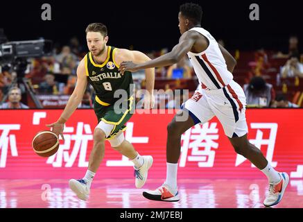 Matthew Dellavedova (L) of Australia Basketball team and Mingxaun Hu (R) of  China basketball team seen in action during the Window 3 of the FIBA  Basketball World Cup 2023 Qualifiers held at