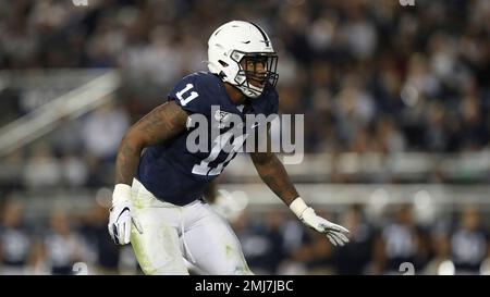 Penn State linebacker Micah Parsons, right, holds a team jersey with NFL  Commissioner Roger Goodell after the was chosen by the Dallas Cowboys with  the 12th pick in the NFL football draft