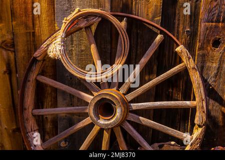 Western Rope And Wooden Wheel Stock Photo