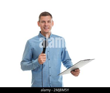 Male journalist with microphone and clipboard on white background Stock Photo