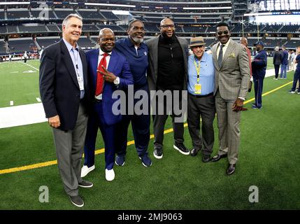 Dallas Cowboys former players Emmitt Smith, left, Troy Aikman, center rear  and Michael Irvin before a halftime ceremony during an NFL football game  against the New York Giants, Sunday, Sept. 20, 2009