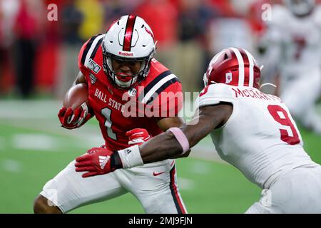 Ball State wide receiver Antwan Davis (1) is tackled by Indiana defensive  back Jaylin Williams (23) during the second half of a college football game  in Indianapolis, Saturday, Aug. 31, 2019. Indiana