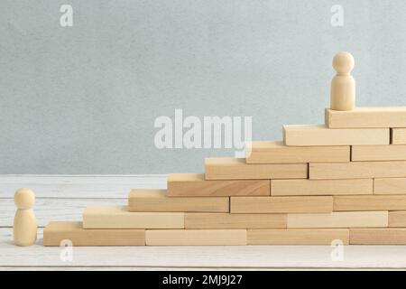 Strat, step and goal symbol. Concept words Start step 1 2 3 goal on wooden blocks on a beautiful blue table blue background. Businessman hand. Busines Stock Photo
