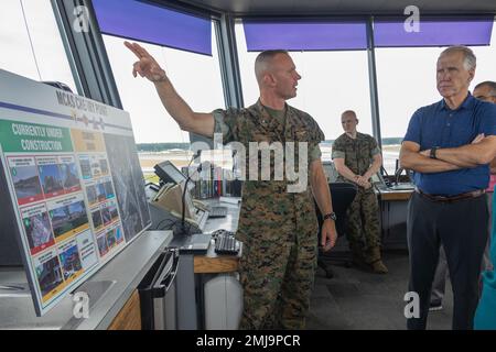 Marine Corps Air Station (MCAS) Cherry Point Commanding Officer Col. Brendan Burks briefs U.S. Senator for North Carolina Thom Tillis and his delegates in the air traffic control tower on new and future construction projects  at MCAS Cherry Point, Aug. 26, 2022. While on the installation, Tillis and his staff gained insight into the current and future operations of the air station, such as the incoming F-35 Lightning II squadrons, Hurricane Florence recovery projects, and local environmental conservation efforts. Stock Photo