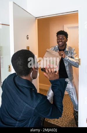 IMAGE DISTRIBUTED FOR PANERA BREAD DELIVERY - Lil Nas X Makes the Ultimate Panera Panini Delivery on Sunday, Aug. 25, 2019 in New York. (Eric Lagg/Panera Bread Delivery via Invision)