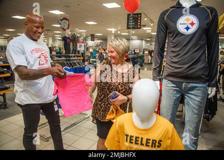 IMAGE DISTRIBUTED FOR JCPENNEY - Pittsburgh Steelers linebacker Ryan  Shazier poses for a photo with Amy Nichols, Fulton Elementary School 3rd  grade math specialist, after he surprised 24 teachers from the school with  a shopping spree at the