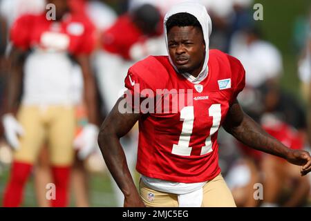 San Francisco 49ers wide receiver Deebo Samuel (19) rides a stationary bike  on the sideline during the second half of an NFL football game against the  New Orleans Saints in Santa Clara