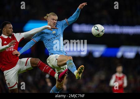 Manchester, UK. 28th Jan, 2023. Manchester City's Erling Haaland (R) shoots under pressure from Arsenal's Gabriel Magalhaes during the FA Cup fourth round match between Manchester City and Arsenal in Manchester, Britain, Jan. 27, 2023. Credit: Xinhua/Alamy Live News Stock Photo