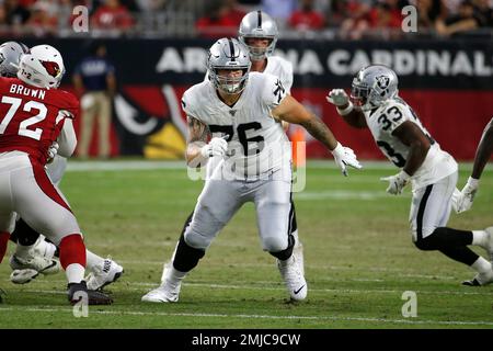 Oakland Raiders offensive guard Jordan Devey (65), center Richie Incognito  (64), and offensive …