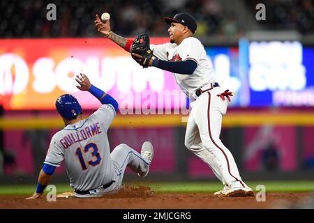 St. Louis, United States. 27th Apr, 2022. St. Louis Cardinals Edmundo Sosa  puts the tag on the sliding New York Mets Luis Guillorme at third base in  the sixth inning at Busch