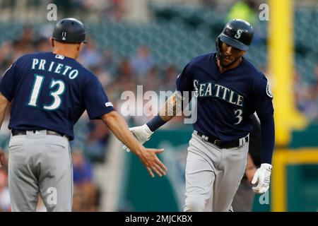 Seattle Mariners' J.P. Crawford (3) is greeted by Ty France after Crawford  scored in the eighth inning of the team's baseball game against the Los  Angeles Angels, Friday, April 30, 2021, in