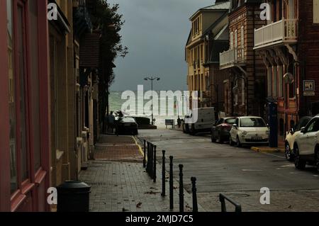 Street Leading To The Wild Sea In Villers-sur-Mer Normandy France On A Beautiful Sunny Summer Day With A Few Clouds In The Sky Stock Photo