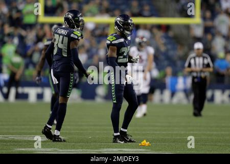 Seattle Seahawks defensive back Marquise Blair, right, hits Denver Broncos  wide receiver Nick Williams, drawing a penalty flag for unnecessary  roughness, during the second half of an NFL football preseason game,  Thursday