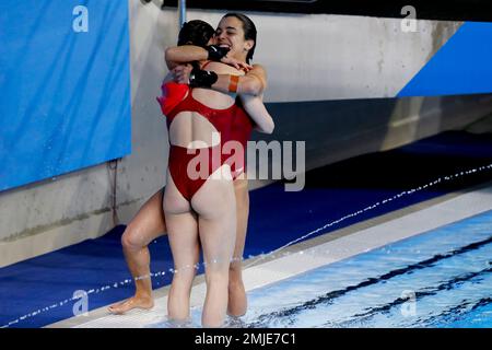 Canada's Meaghan Benfeito and Caeli McKay embrace after