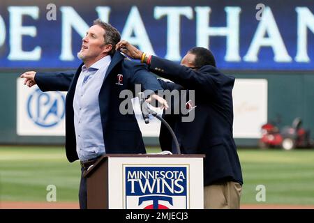 Minnesota Twins catcher Joe Mauer, left, and relief pitcher Joe Nathan  celebrate their 7-4 win over the Chicago Cubs after an interleague baseball  game, Friday, June 12, 2009 at Wrigley Field in