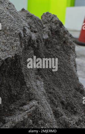 portrait of gray sand dunes as a raw material for building (walls, walls, houses, and so on). Stock Photo