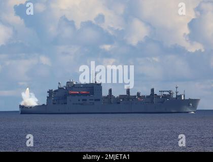 PHILIPPINE SEA (Aug. 28, 2022) – Lewis and Clark-class dry cargo and ammunition ship USNS Alan Shepard (T-AKE 3) launches a drone during an SM-2 Standard Missile exercise conducted with Arleigh Burke-class guided-missile destroyer USS Barry (DDG 52) as part of Pacific Vanguard (PV) 22 while operating in the Philippine Sea, Aug. 28. PV 22 is an exercise with a focus on interoperability and the advanced training and integration of allied maritime forces. Stock Photo