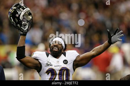 Baltimore Ravens safety Ed Reed celebrates with the Lombardi trophy with  line backer Ray Lewis looking on at Super Bowl XLVII at the Mercedes-Benz  Superdome on February 3, 2013 in New Orleans.