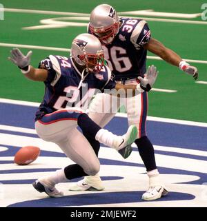 3 Feb 2002: Ty Law of the New England Patriots returns an interception for  a TD during the Patriots 20-17 victory over the St. Louis Rams in Super Bowl  XXXVI at the