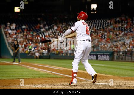 Washington Nationals Anthony Rendon watches the flight of a first