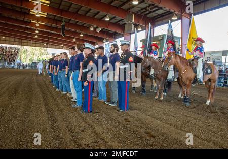 Future Marines in the delayed entry program with Recruiting Sub Station Corona, recite the Oath of Enlistment during the opening ceremony at the Norco Rodeo, Norco, California, Aug. 28, 2022. The Oath of Enlistment solidifies the individual's promise to support and defend the U.S. Constitution. Stock Photo