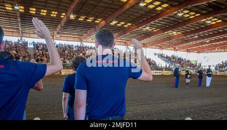 Future Marines in the delayed entry program with Recruiting Sub Station Corona, recite the Oath of Enlistment during the opening ceremony at the Norco Rodeo, Norco, California, Aug. 28, 2022. The Oath of Enlistment solidifies the individual's promise to support and defend the U.S. Constitution. Stock Photo