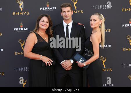Audrey Melugin, from left, Bill Melugin, and Katy Johnson arrive at the