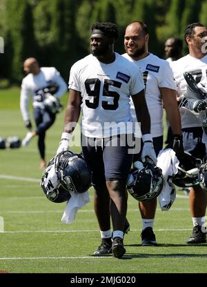 Seattle Seahawks defensive end L.J. Collier, (95), walks with his fiancé,  Samantha Lane, after the first day of NFL football rookie mini camp,  Friday, May 3, 2019, in Renton, Wash. (AP Photo/Ted