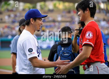 Los Angeles Angels' Shohei Ohtani bends over at the waist after fouling off  a pitch from Texas Rangers relief pitcher Brett Martin that hit him on the  groin during the seventh inning