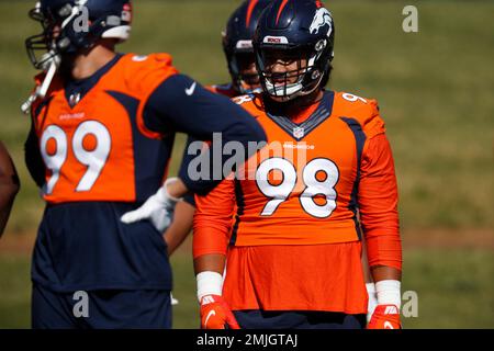 Denver Broncos defensive lineman Mike Purcell takes part in drills