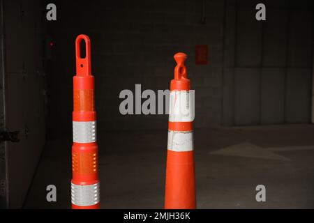 construction cones middle of street roadblock danger orange Stock Photo