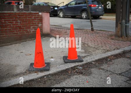 construction cones middle of street roadblock danger orange Stock Photo