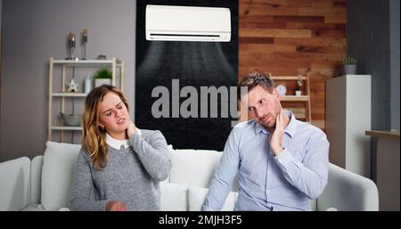 Sick Couple Having Cold And Sore Throat From Air Conditioner Stock Photo