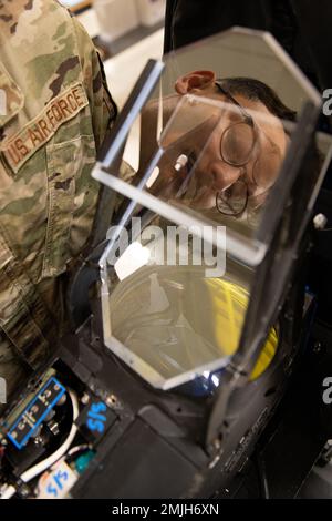 Senior Airman Mike Azevedo, 18th Component Maintenance Squadron avionics intermediate shop journeyman, looks over an F-15C Eagle’s heads-up display in the AIS at Kadena Air Base, Japan, Aug. 29, 2022. A HUD line replaceable unit provides pilots navigational information in support of other instruments, allowing them to keep their eyes on the sky at all times. Stock Photo