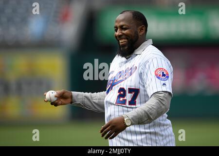 Vladimir Guerrero prepares to throw out the ceremonial first pitch before a  baseball game between the Washington Nationals and the Kansas City Royals,  Saturday, July 6, 2019, in Washington. The Nationals are