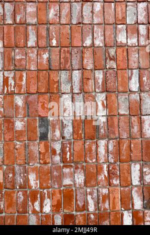 A close up of a weathered red brick wall. Stock Photo