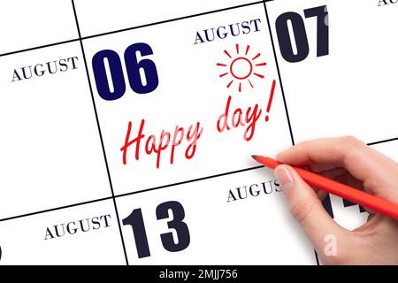 6th day of August. Hand writing the text HAPPY DAY and drawing the sun on the calendar date August 6. Save the date. Holiday. Motivation. Summer month Stock Photo