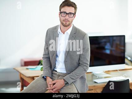 Hes at the top of his game. Portrait of a handsome male designer in his modern office. Stock Photo