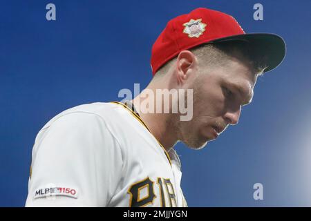 Pittsburgh Pirates left fielder Corey Dickerson, right, holds his Rawlings  Gold Glove award as former Pirates Gold Glove center fielder Andy Van Slyke,  left, looks on during a presentation before the team's