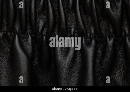 background of black pleated faux fabric Stock Photo