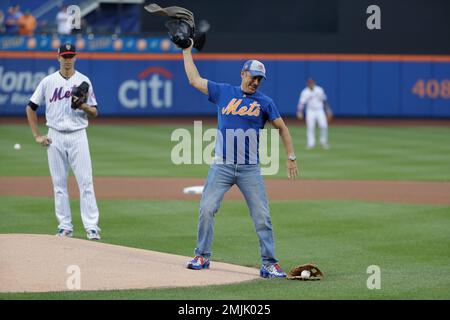 Jerry Seinfeld throws out the first pitch before a game between the