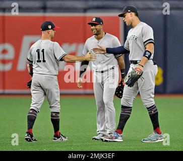 New York Yankees outfielders Brett Gardner (11) and Aaron Judge