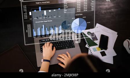 Woman, hands and laptop with hologram in analytics for chart, graph or marketing statistics at the office. Female analysis checking 3D digital data Stock Photo