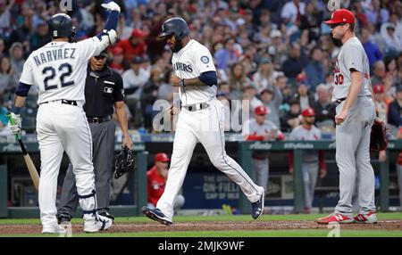 Seattle Mariners' Omar Narvaez (22) is greeted by manager Scott