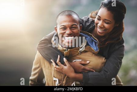 Enjoying the thrill of young love. Portrait of a happy young couple having fun outside. Stock Photo