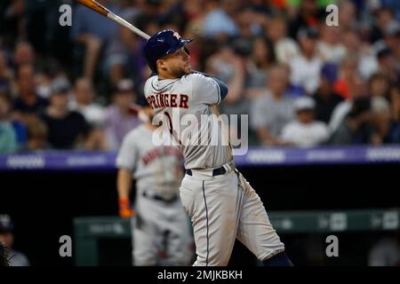 Houston Astros center fielder George Springer (L) celebrates with teammate  Carlos Correa after hitting a solo home run against the Los Angeles Dodgers  in the third inning of the 2017 MLB World