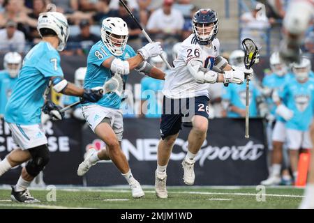 IMAGE DISTRIBUTED FOR PREMIER LACROSSE LEAGUE - Archers midfielder Austin  Sims (18) is defended by Atlas defender Kyle Hartzell (81)during a Premier  Lacrosse League game on Friday, June 28, 2019 in Atlanta. (