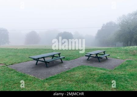 Children's play equipment at a local park in the fog Stock Photo