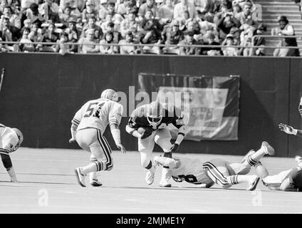 New Jersey Generals' Herschel Walker is held to a six-yard gain by Fred  Nordgren of the Tampa Bay Bandits during the Generals' home opening game at  Giants Stadium in East Rutherford, N.J.